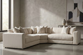 Lower angle shot of Dominic Sectional emphasizing proportions with textured wall and minimalist decor.