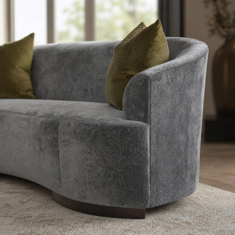 Close-up of the Allure Sofa's armrest highlighting fabric detailing and elegant height.