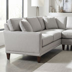 Eye-level image focusing on stitching and cushion details of Townsend Sectional in bright modern living space with natural light.