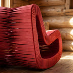 Close-up of the braided backside and woven fabric straps of the Seat Belt Rocking Chair, highlighting intricate braiding and texture.