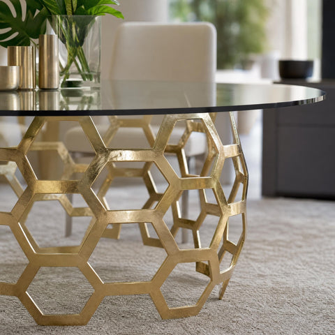 Close-up angled view of Dolma Dining Table edge, emphasizing seamless glass integration and reflective brass surfaces.