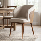 Close-up of Laurent Dining Chair's stained-resistant fabric upholstery with natural daylight highlighting texture in a blurred dining room scene.
