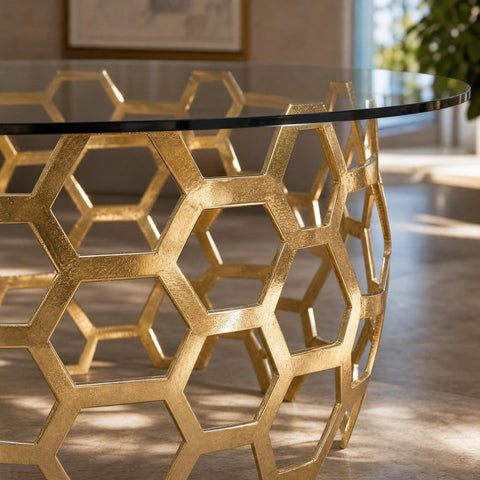 Close-up of Dolma Dining Table's brass-plated cast aluminum hexagon weave highlighting intricate geometric pattern and high-shine polish.