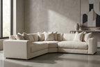Lower angle shot of Dominic Sectional emphasizing proportions with textured wall and minimalist decor.