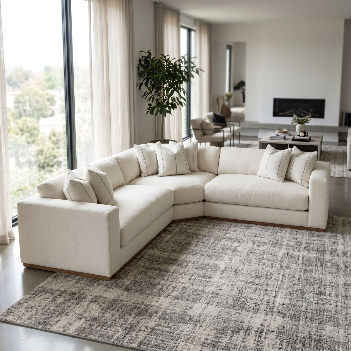 Profile view of Dominic Sectional highlighting solid wood frame and warm tones in a contemporary living room.