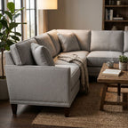 Side perspective of Townsend Sectional in a cozy interior setting emphasizing sturdy build and premium fabric under warm lighting.
