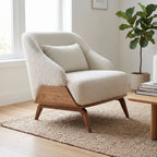 Detailed shot of the wooden armrest and upholstered back of Eva Lounge Chair in a stylish living area.