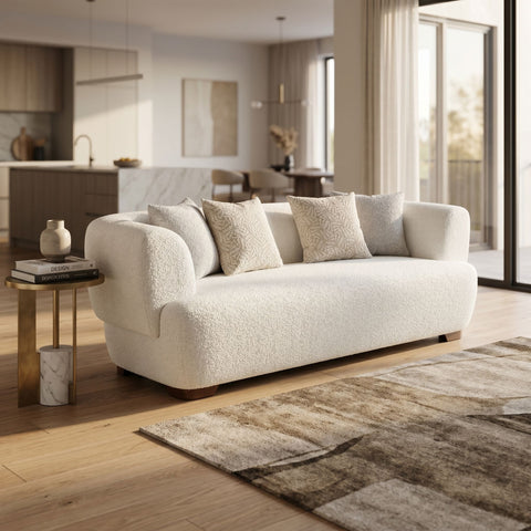 Full view of Huxley sofa in a contemporary living space highlighting its proportions, fabric, and surrounding decor.