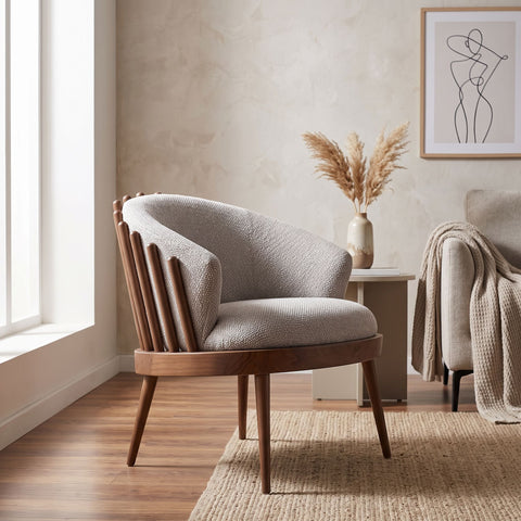 Side view of Reveal Chair showcasing its supportive cushioned seat in a modern living room setting.