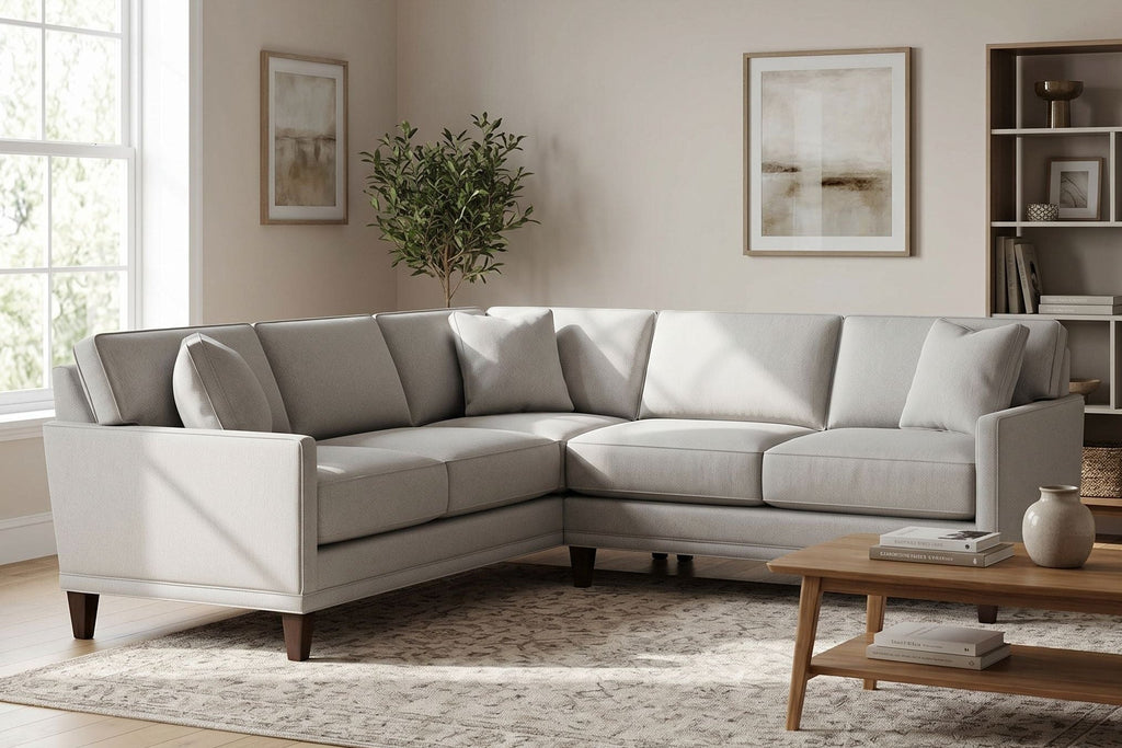 Full scene of Townsend Sectional in a chic living room highlighting its size, craftsmanship, and plush cushions with neutral decor.