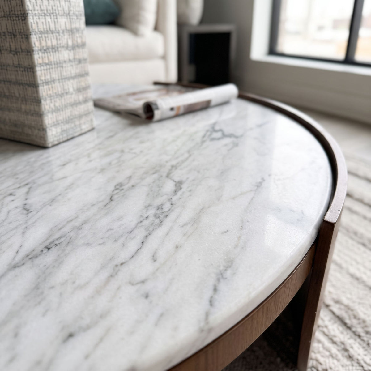 Close-up of Heba Coffee Table's marble surface highlighting veining and organic patterns.