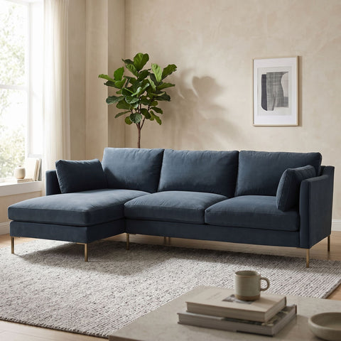 Cozy home setting featuring the Holloway Sectional with inviting shapes, fabric cushions, and visible wooden finish.