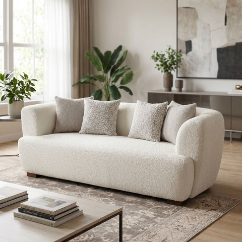 Huxley sofa in a modern living room with natural daylight, emphasizing its clean lines and textured upholstery.