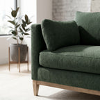 Close-up of the Leo Sectional's fabric upholstery showing craftsmanship, stitching, and vibrant texture with natural light in a modern living space.