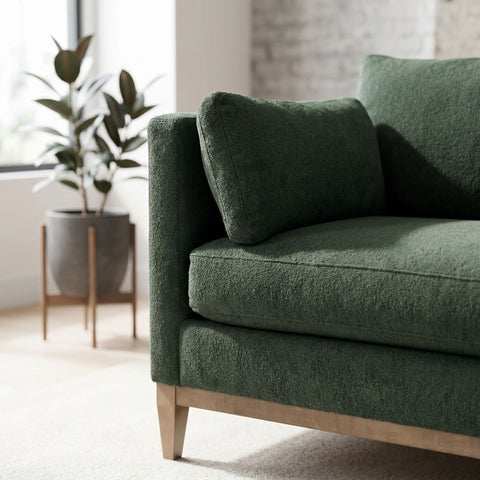 Close-up of the Leo Sectional's fabric upholstery showing craftsmanship, stitching, and vibrant texture with natural light in a modern living space.