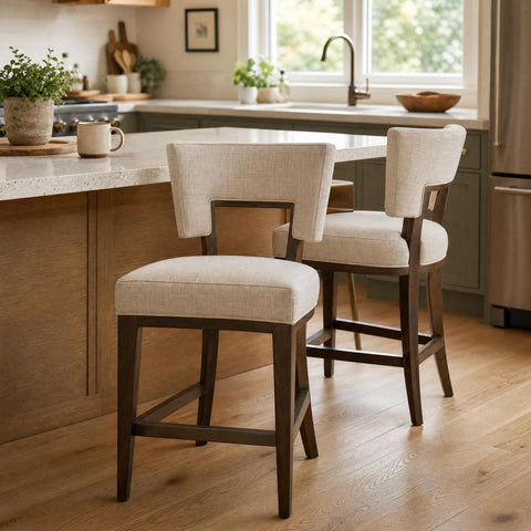 Lifestyle scene of Barrow fabric counter stool at a breakfast bar in a lived-in kitchen setting.
