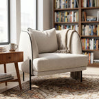 Giroud Chair in a relaxed reading corner with bright natural light, showcasing inviting comfort and stylish environment.