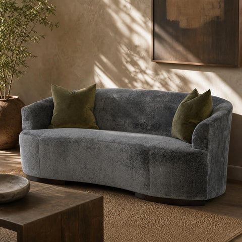 Side view of the Allure Sofa showcasing craftsmanship and proportions against neutral wall.