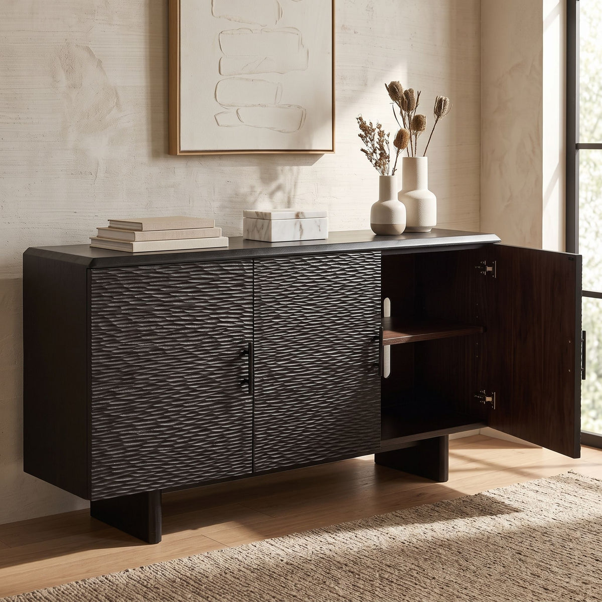 Full view of the Silvanos Sideboard in a modern living space with natural light, showing adjustable shelves and media access design.