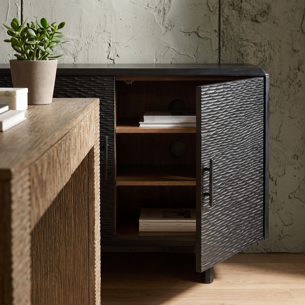 Side perspective of the Silvanos Sideboard showing adjustable shelves through open doors in a stylish home office setting.