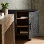 Side perspective of the Silvanos Sideboard showing adjustable shelves through open doors in a stylish home office setting.