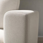 Close-up of durable off-white textured fabric on the armrest of the Stockdale classic sleeper sofa.
