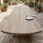 Top-down view of teak table surface focusing on grain and weathered finish, ideal for outdoor dining.