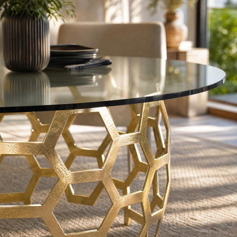 Dining area with natural sunlight emphasizing the edge detail of Dolma Table, showcasing craftsmanship and shiny brass finish.